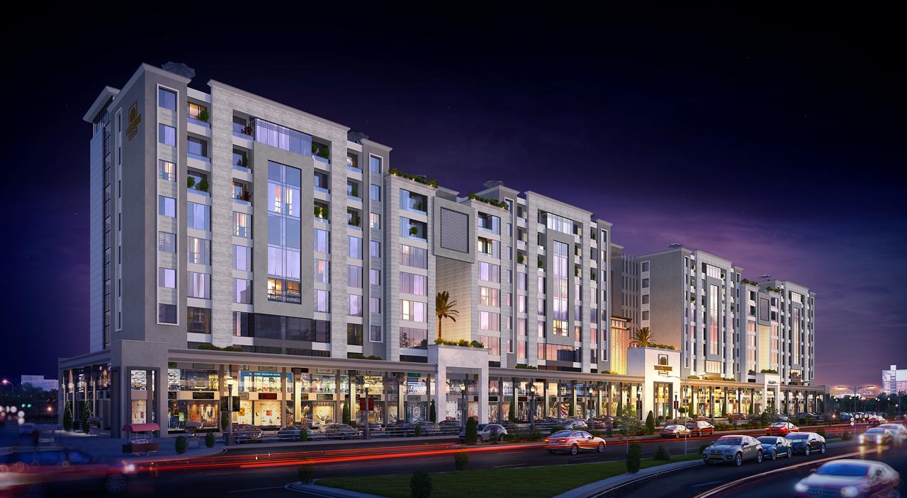 A stunning night view of the Times Square Mall & Residencia building in Lahore